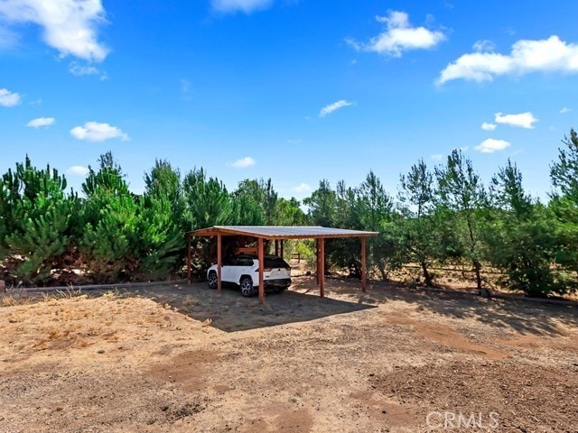 view of yard featuring a carport