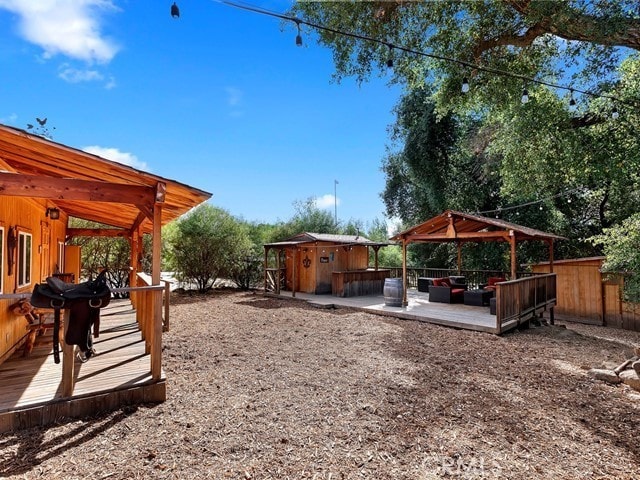 view of yard with a wooden deck