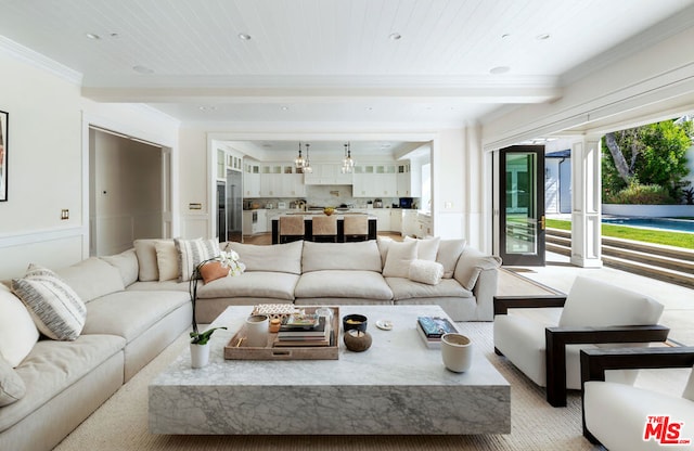 living room featuring wooden ceiling and crown molding