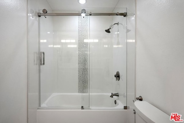 bathroom with toilet and enclosed tub / shower combo