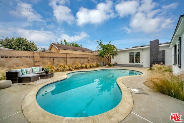 view of pool with a patio area