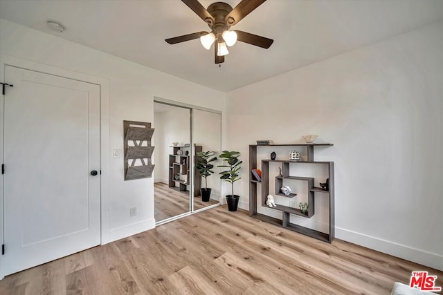 interior space featuring light hardwood / wood-style floors and ceiling fan