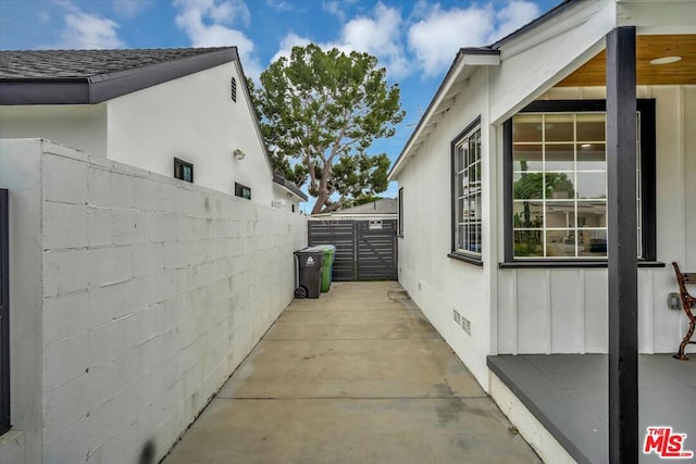 view of side of property featuring a patio