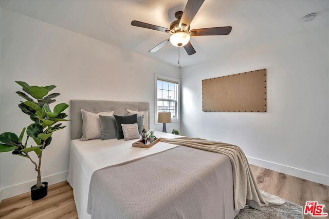 bedroom featuring light wood-type flooring and ceiling fan