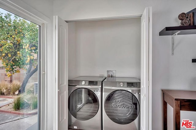 washroom featuring washer and dryer