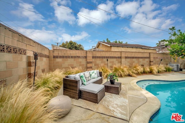 view of swimming pool with central air condition unit, an outdoor living space, and a patio