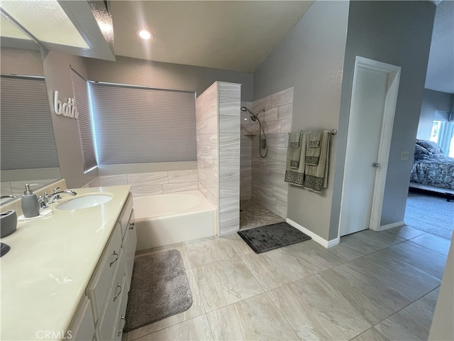 bathroom featuring vanity, lofted ceiling, and plus walk in shower