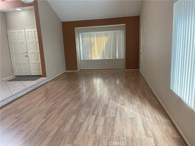 unfurnished room with light wood-type flooring