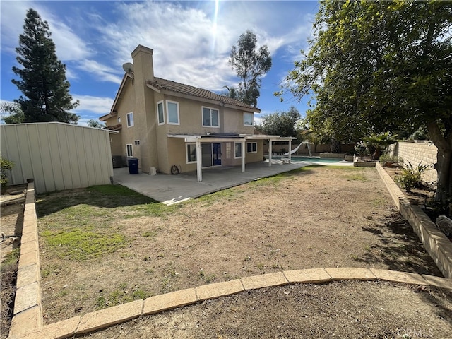 back of property featuring a patio