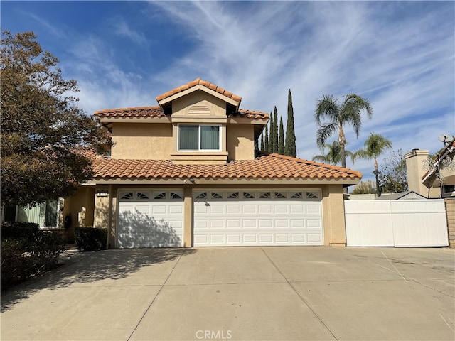 mediterranean / spanish-style house featuring a garage