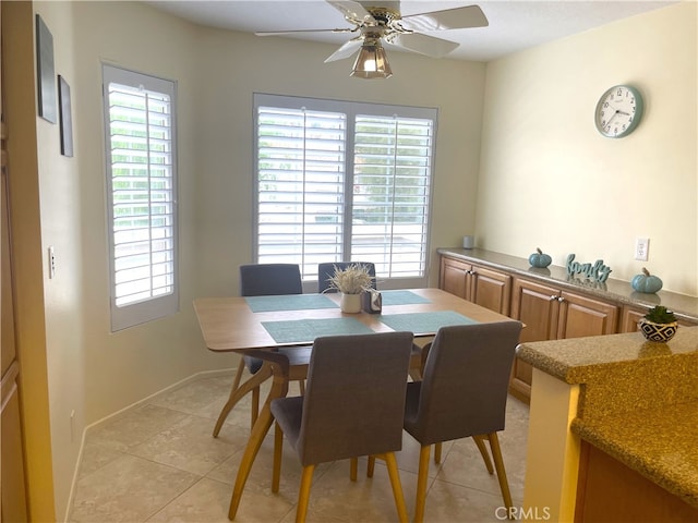 tiled dining area featuring ceiling fan and a wealth of natural light