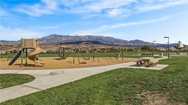 exterior space featuring a mountain view and a yard