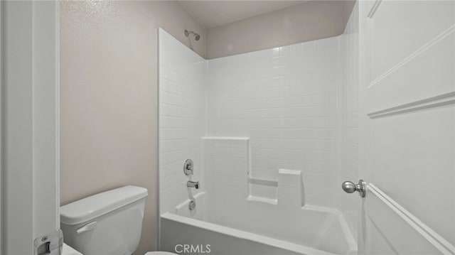 bathroom with toilet and shower / tub combination