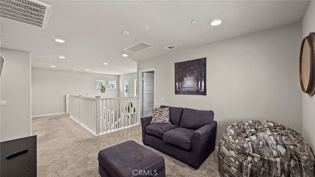 living area with light colored carpet