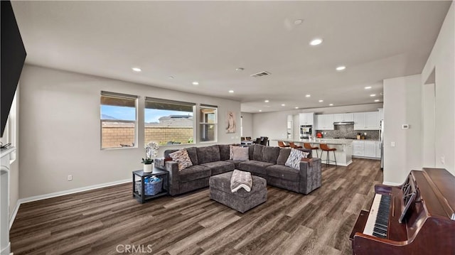 living room featuring dark hardwood / wood-style floors