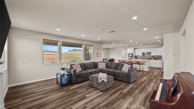 living room with dark wood-type flooring