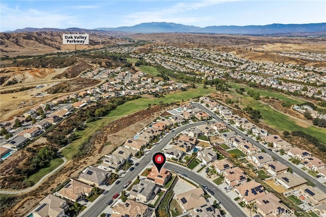 birds eye view of property featuring a mountain view