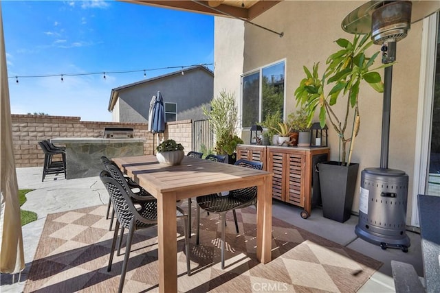 view of patio featuring an outdoor bar