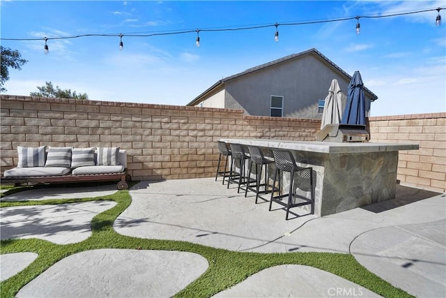 view of patio featuring a bar