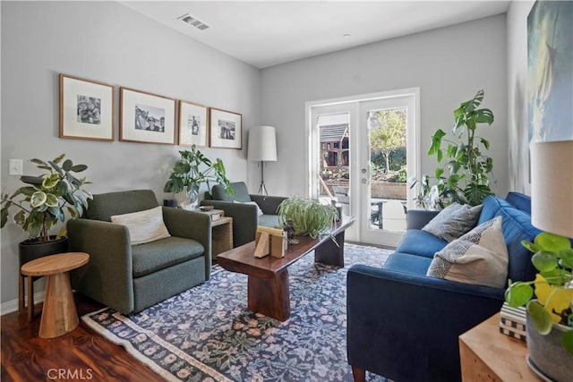 living room with wood-type flooring and french doors