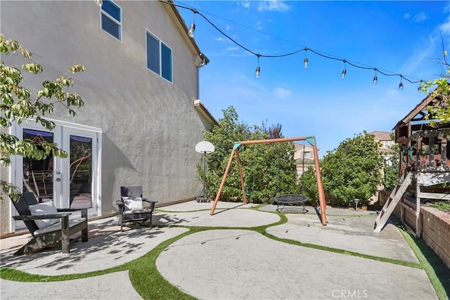 view of play area with french doors and a patio