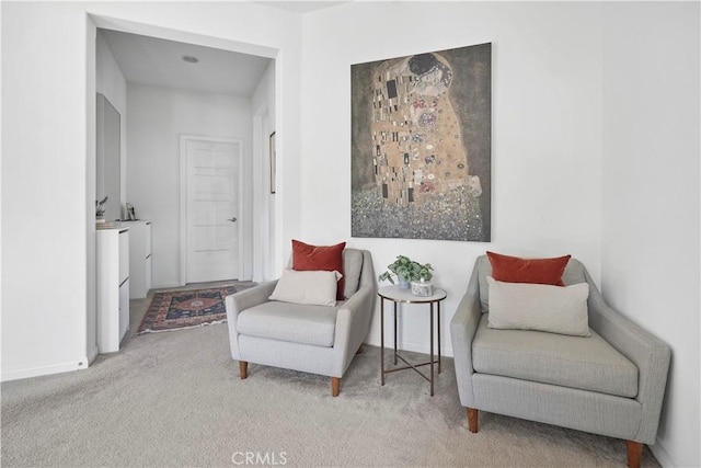 living area with light colored carpet