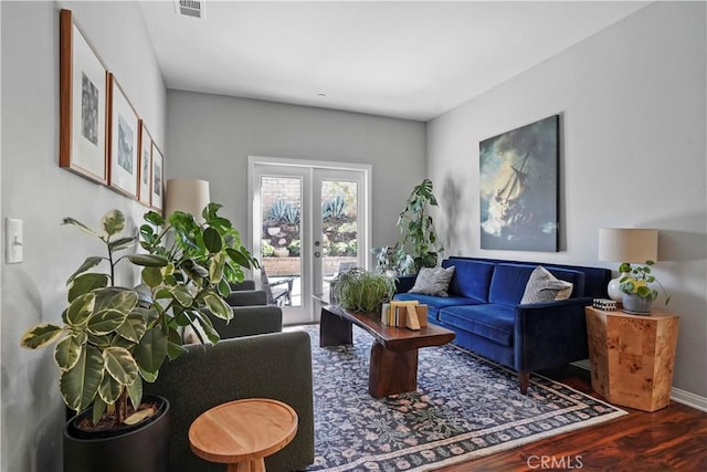 living room featuring french doors and hardwood / wood-style flooring