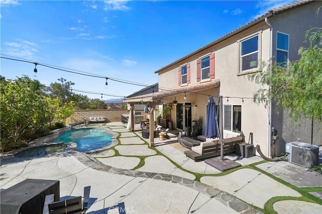 exterior space featuring cooling unit, a patio area, an outdoor hangout area, and a fenced in pool