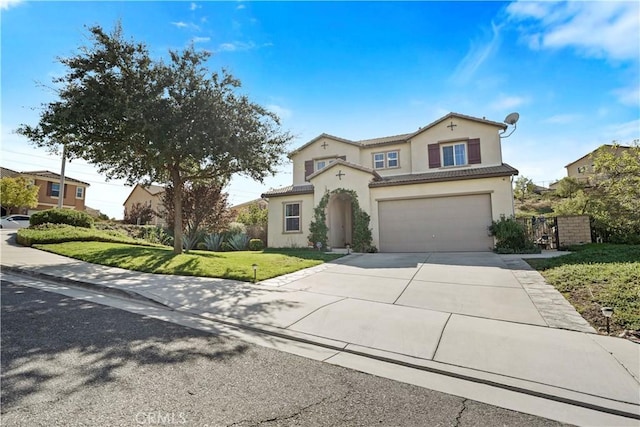 view of front of home with a front yard and a garage