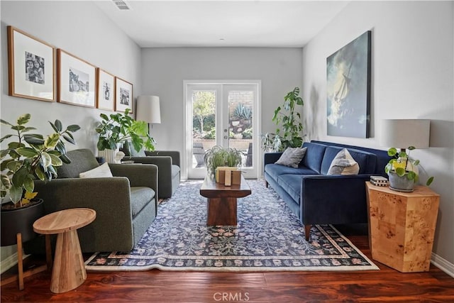 living room featuring french doors and hardwood / wood-style flooring