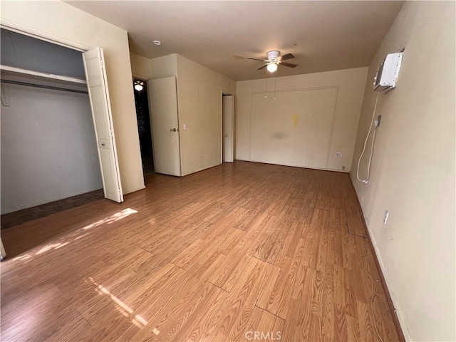 unfurnished bedroom with ceiling fan and light hardwood / wood-style floors