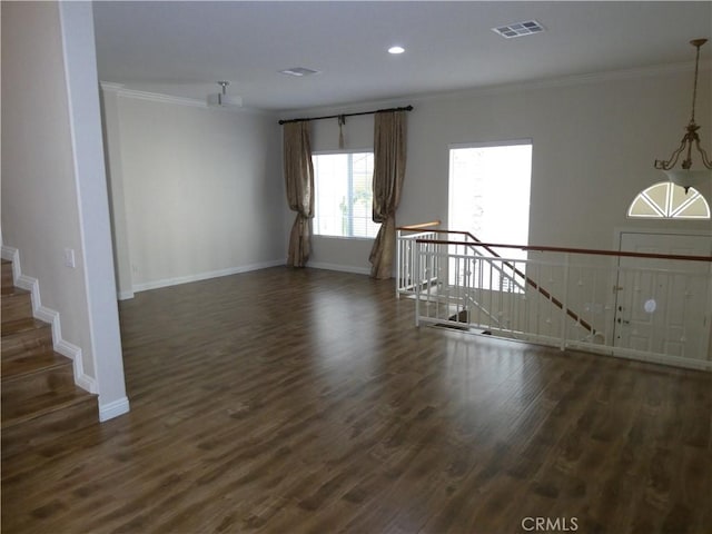 unfurnished room featuring dark hardwood / wood-style flooring and ornamental molding