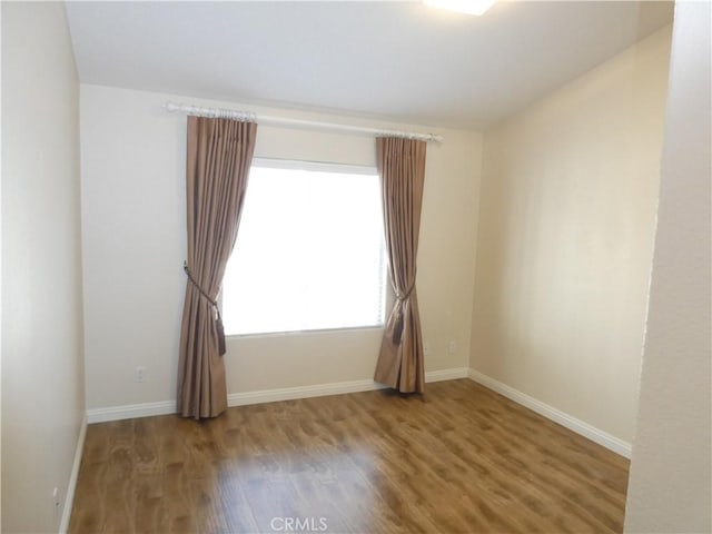 spare room featuring hardwood / wood-style floors