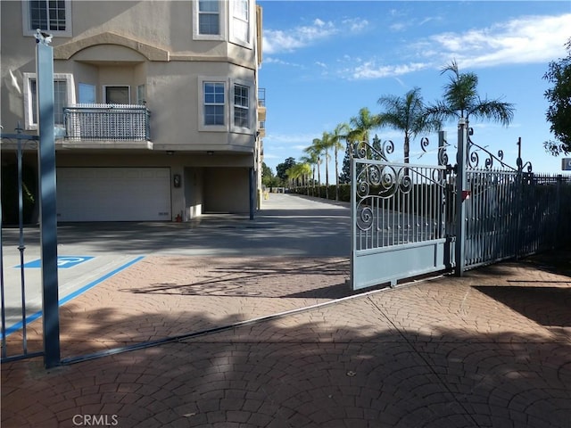 view of gate featuring a garage