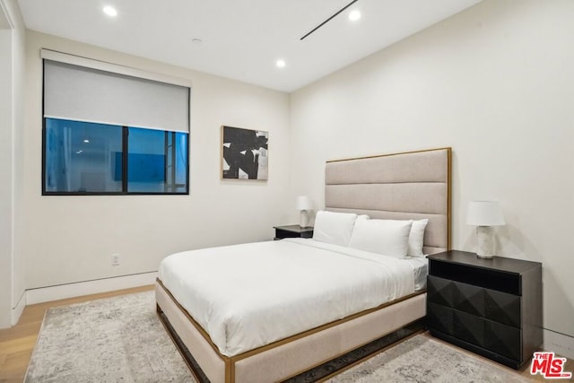 bedroom featuring light hardwood / wood-style flooring