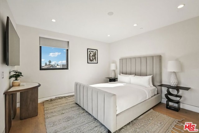 bedroom featuring light hardwood / wood-style floors