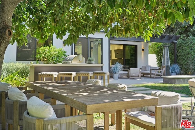 view of patio / terrace featuring outdoor lounge area, area for grilling, and exterior kitchen