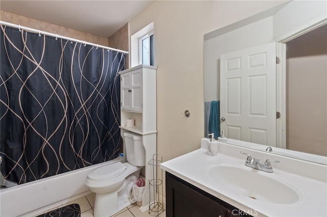 full bathroom featuring tile patterned floors, vanity, toilet, and shower / bath combo with shower curtain