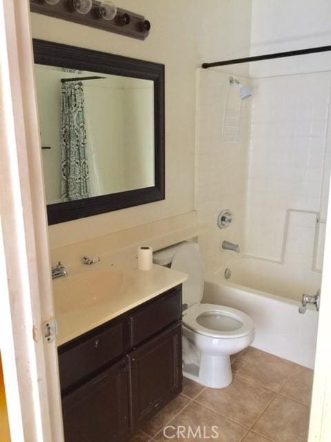 full bathroom featuring tile patterned flooring, vanity, shower / tub combo, and toilet