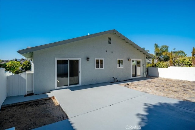 back of house featuring a patio