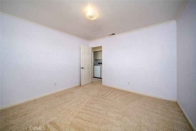 empty room with light carpet and crown molding