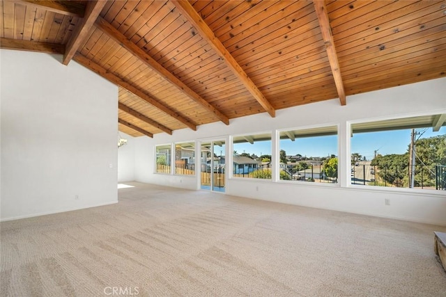 unfurnished living room with vaulted ceiling with beams, carpet, wood ceiling, and a notable chandelier