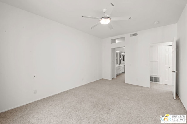 unfurnished bedroom with ceiling fan and light colored carpet