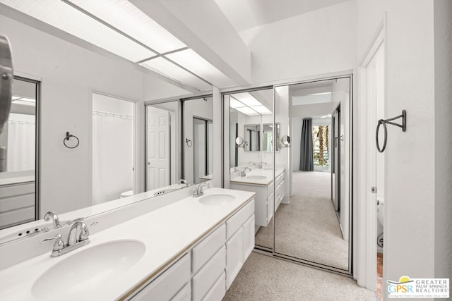 bathroom with toilet and vanity