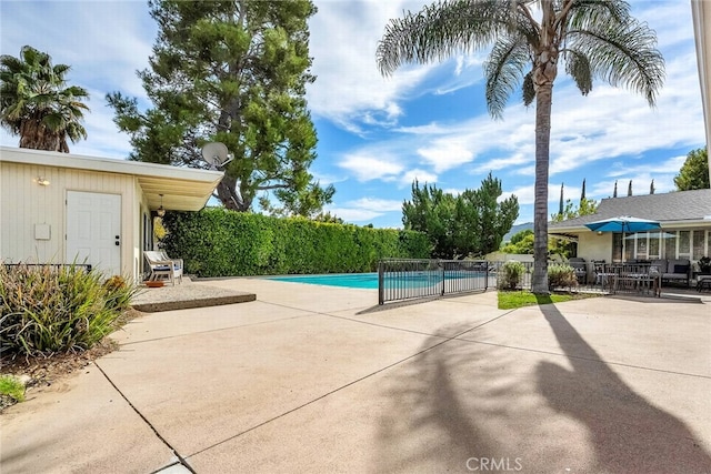 view of swimming pool with a patio