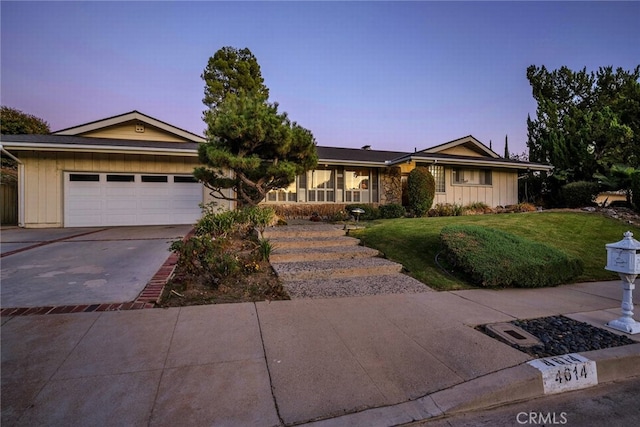 4614 La Subida Pl, Tarzana, CA 91356 - single story home featuring board and batten siding, a garage, concrete driveway, and a front yard