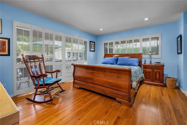 bedroom with light hardwood / wood-style flooring