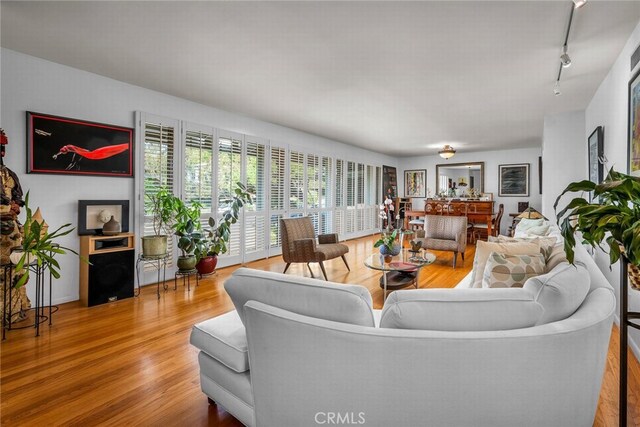 4614 La Subida Pl, Tarzana, CA 91356 - living area featuring wood finished floors and track lighting
