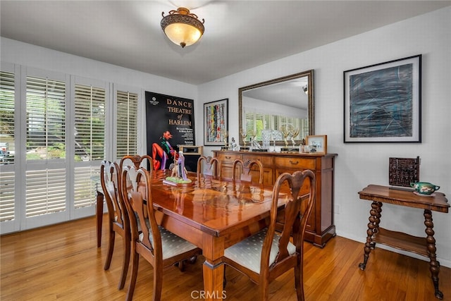 dining area featuring light wood-type flooring