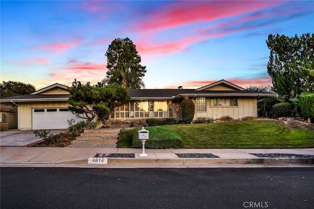 4614 La Subida Pl, Tarzana, CA 91356 - ranch-style house with a garage, driveway, a front yard, and board and batten siding